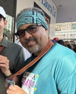Author with Austin Marathon 5K completion buckle medal